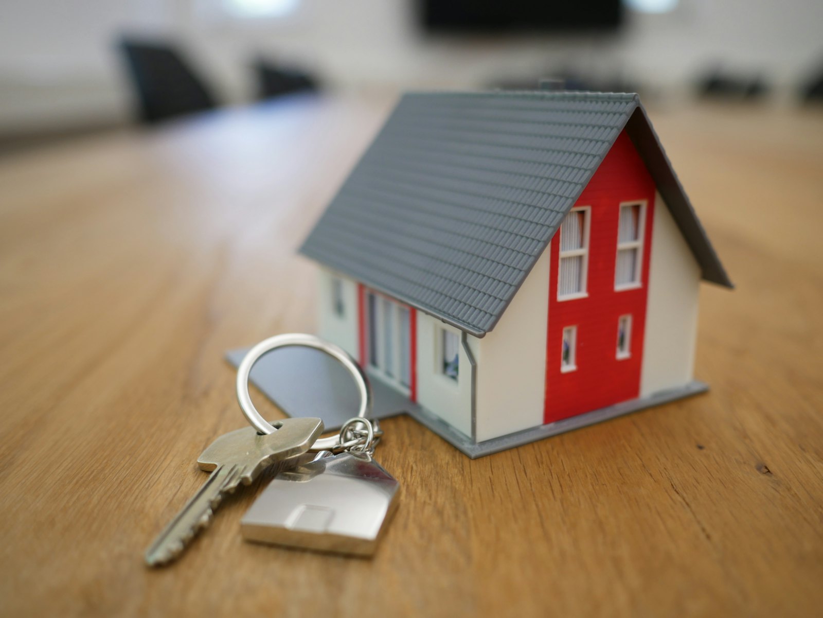Miniature house and keys representing the choice between HOMES and HEAR rebate programs